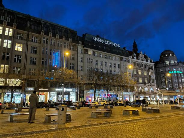 Prague, Czech Republic - January 16, 2024: Stores on Wenceslas Square in Prague at night. Marks & Spencer advertising.