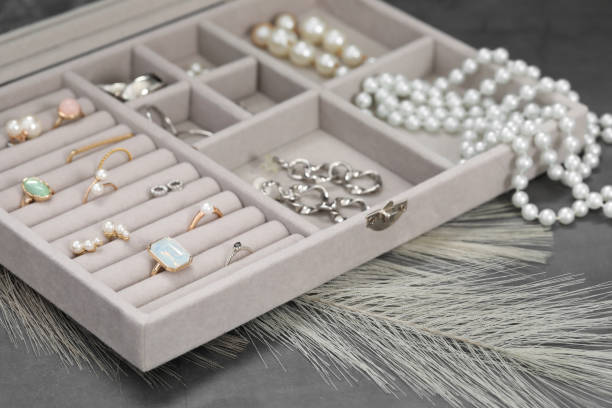 istock Jewelry box with many different accessories on grey table, closeup 1943177283