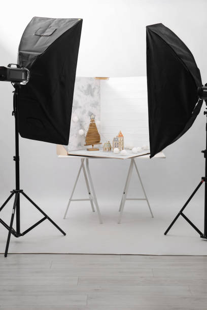 Christmas decor and double-sided backdrops on table in photo studio