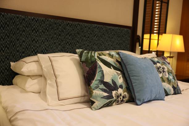 istock Beautiful pillows on bed in hotel room 1943201193