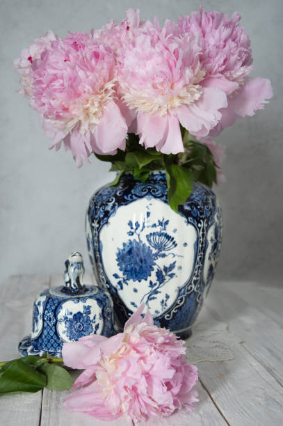 istock pink luxurious peonies in an ancient Chinese vase with blue ornament, springtime 1943253294