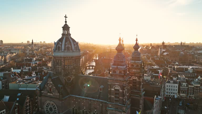 Aerial view of Amsterdam Saint Nicholas basilica at sunset, A Church in Amsterdam, St. Nicholas Church in Amsterdam, Church of Saint Nicholas in Amsterdam