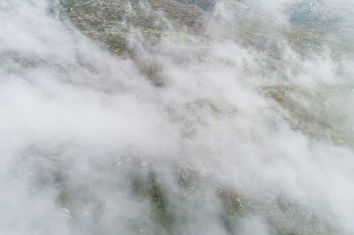 aerial drone view of a cloud-covered mountain in southern Galicia, Spain