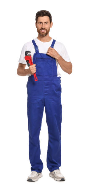 istock Professional plumber with pipe wrench on white background 1943276895