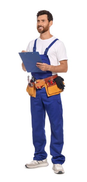 istock Professional plumber with clipboard and tool belt on white background 1943276908