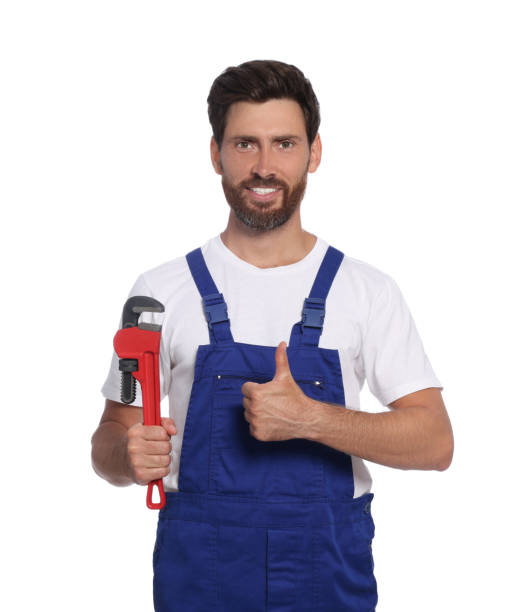 istock Professional plumber with pipe wrench on white background 1943277846