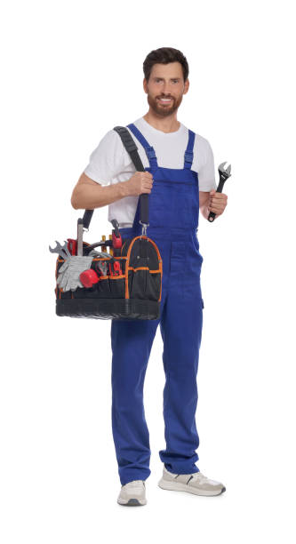 istock Professional plumber with tool bag and adjustable wrench on white background 1943278743