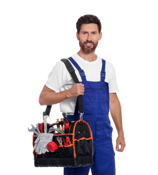 istock Professional plumber with tool bag on white background 1943282698