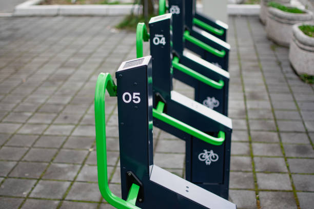 parking and charging point for e-bikes and scooters that can be unlocked with a mobile application or a contactless card in the city