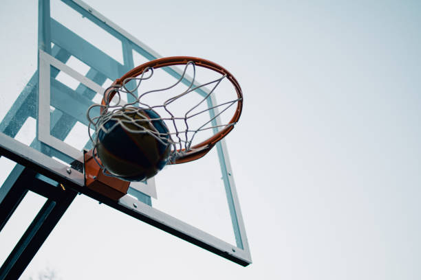 istock hitting the ball into the basket hoop 1943313916