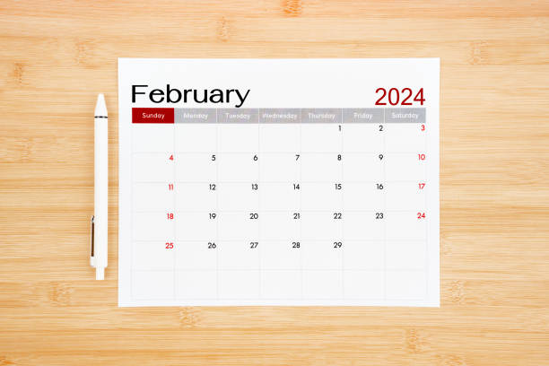 istock February 2024 calendar page on wooden background. 1943362607