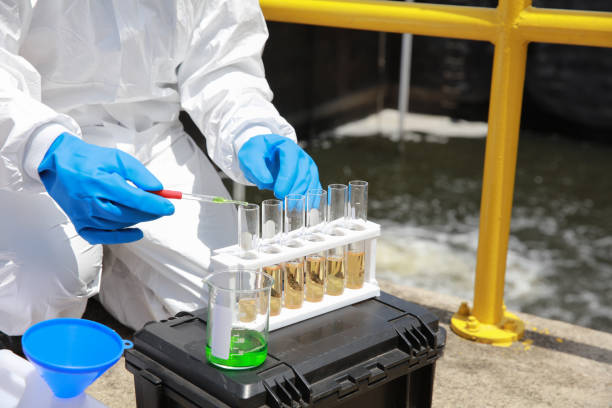 istock Water analysis operator wearing PPE sample and audit water from the water treatment plant, industrial and environment concept 1943363721