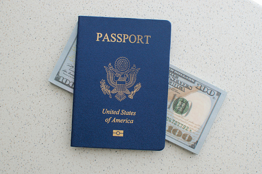 Close-up of a closed American passport, a symbol of travels to the United States of America.