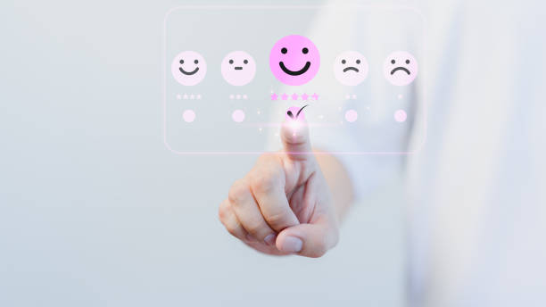 istock Customer Satisfaction Survey online concept, male hand touching virtual screen on happy smile face icon to give satisfaction in service. Assessment testimonial customer service and feedback. 1943412070