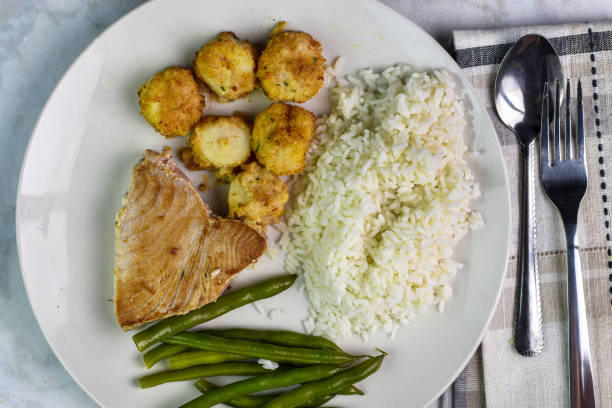 istock tuna steak with scallops , rice and green beans, 1943422661