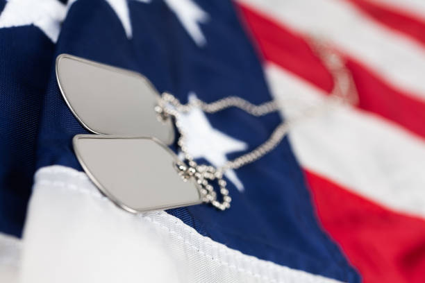 istock US army dog tags on USA national flag 1943485578
