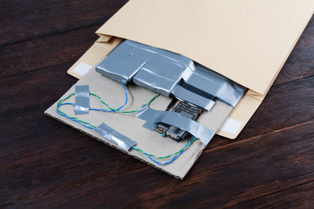 istock Mail bomb IED - Improvised Explosive Device with c4 and cell phone module in envelope 1943486664