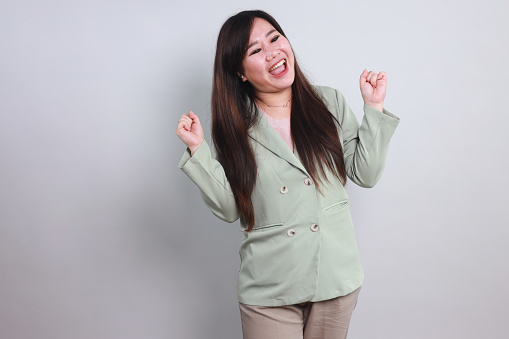 Portrait of Cheerful Female Student Wearing Formal Wear Celebrating Victory for Upgrade Job Skills