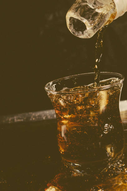 istock black soda splash close up 1943619642