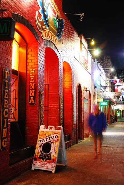 Austin, TX, USA November 11 An adult man walks on the sidewalks near the bars and taverns of the famed Sixth Street entertainment district in Austin, Texas