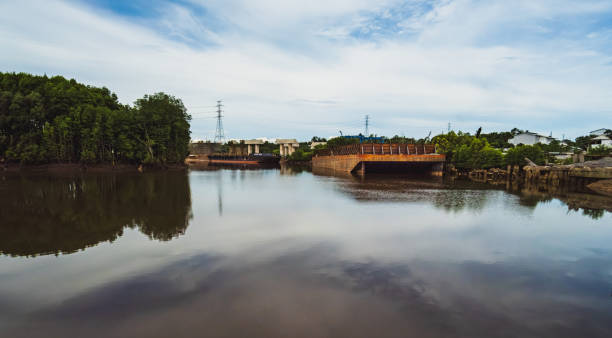 istock a big old and rusty Pontoon boat floating on Wain river 1943643851