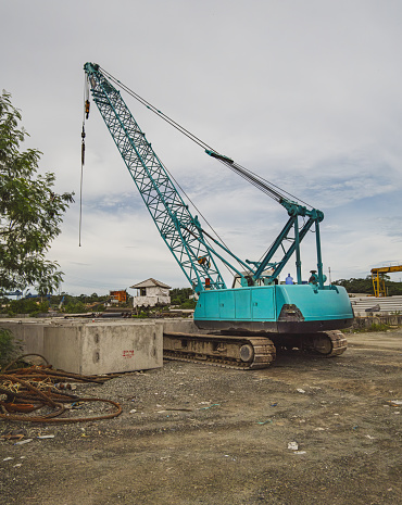 It is a large, lattice-boom crane that is typically used for heavy construction and lifting work