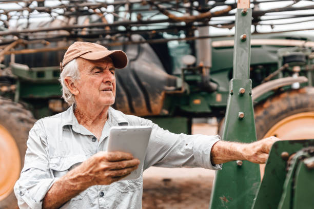 istock Farmer inspecting agricultural equipment 1943664595