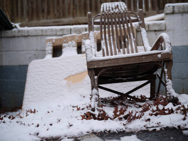 Abandoned rocking chair by a dumpster after snow miscellaneous background