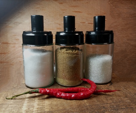 Three jars of seasoning spices