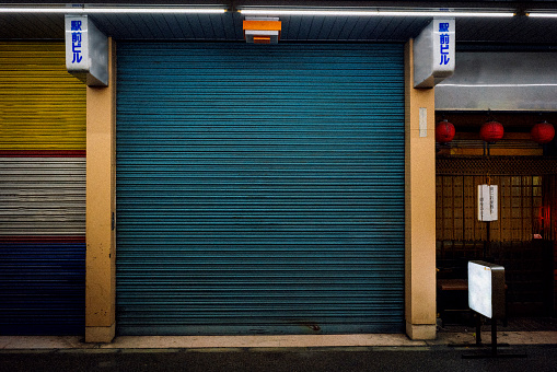 Closing the shutters and closing the shop.