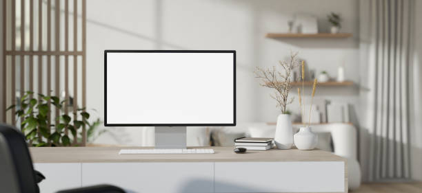istock Interior design of a modern white home office workspace with a PC computer mockup on a desk. 1943750640