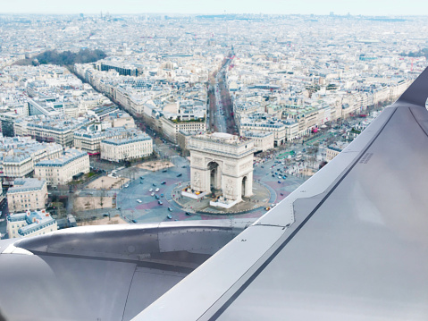 Looking out to Champs-Élysées in Paris from a flying passenger plane window