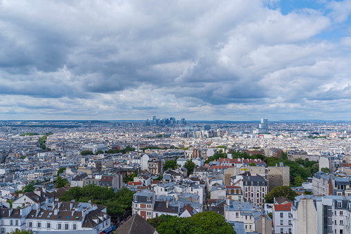 Paris, France - July 23, 2023: Aerial view of city viewed from atop landmark basilica toward Central Business District.