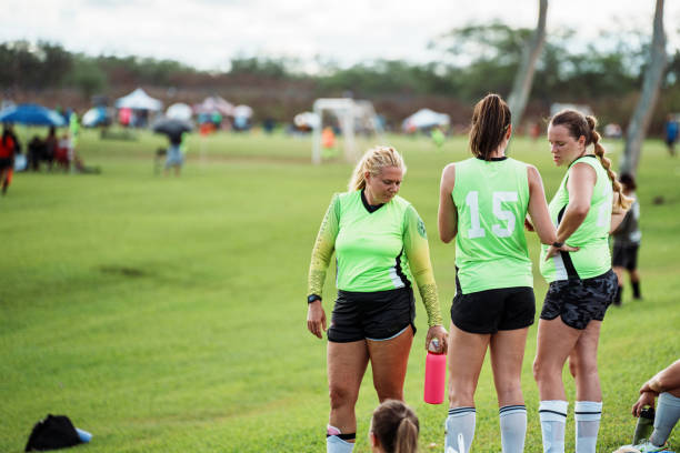 istock Female athletes stand on the sideline during a soccer game 1943833724