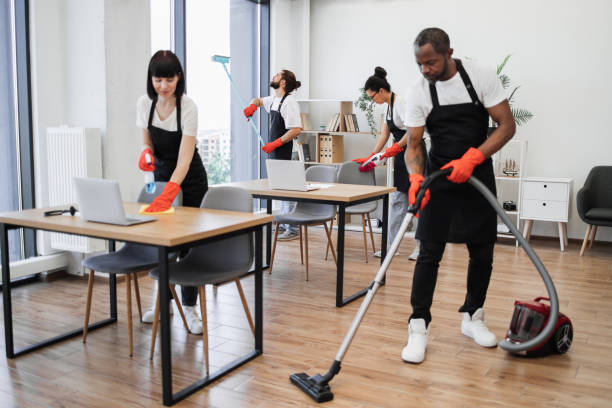 istock People of cleaning service cleans tables, floor, and panoramic windows. 1943841899