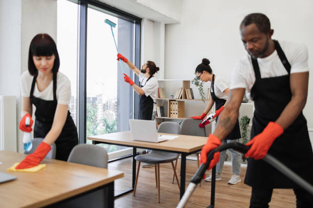 istock People of cleaning service cleans tables, floor, and panoramic windows. 1943842193