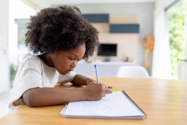 istock African American girl doing her homework 1943859923