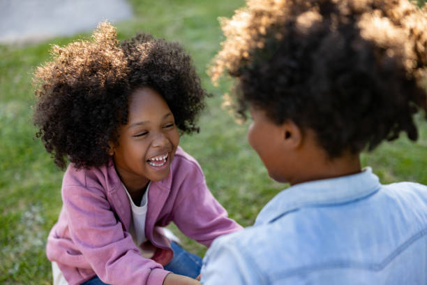 istock Girl having fun playing outdoors with her mother 1943860443