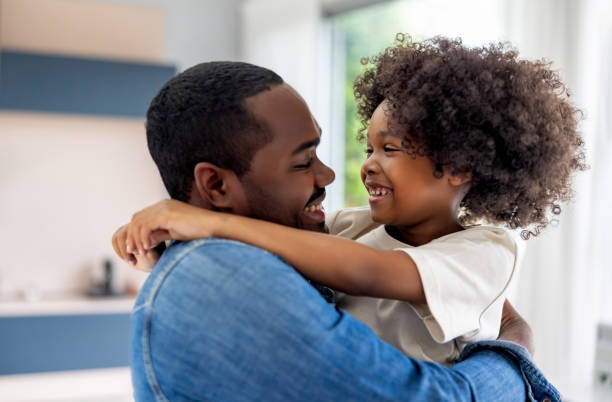 istock Loving daughter hugging her father at home 1943860450