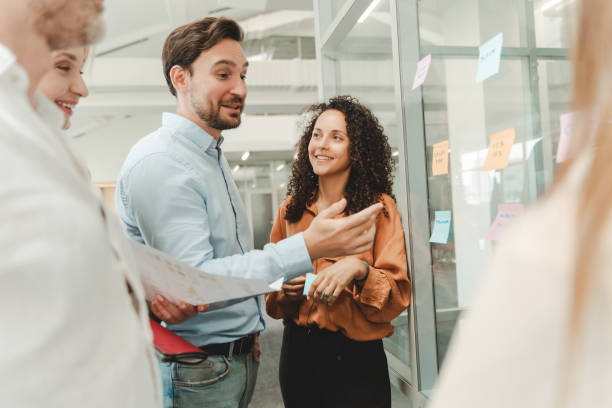 istock Businesspeople using sticky notes, agile methodology for productivity working in modern office 1943864716