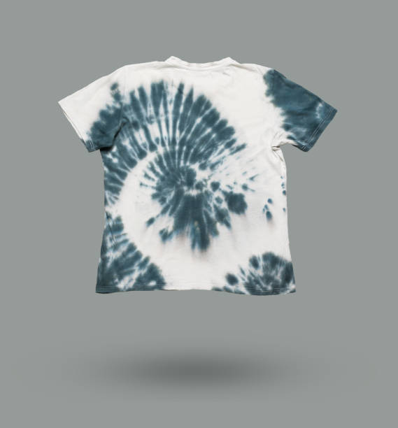 istock White and gray tie dye T-shirt on a gray background. 1943885042