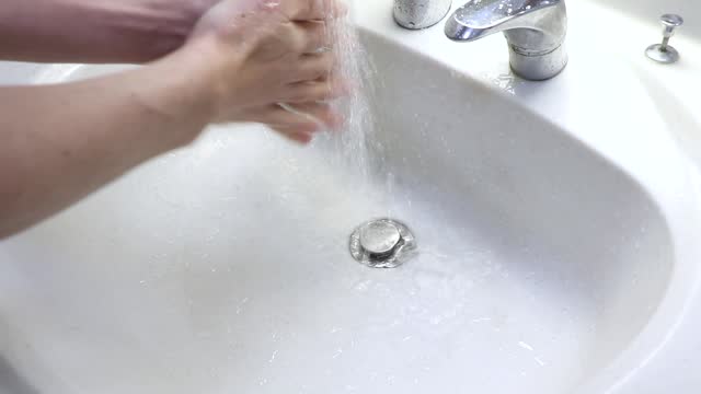 wash hands in the washbasin