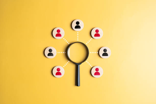 istock Human resource management, HR professional to selective career recruitment sites for finding new talent. Magnifier looking for employees on wood cubes with connected lines. Find a leader or employee. 1943912012