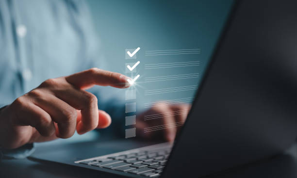istock Businessman marks checkboxes. The survey form, check marks on a checklist, fill out online form, and answer questions. List options for business security procedures followed office. Checklist concept. 1943913599