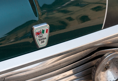 Gubbio Italy - May 12 2011; Stylish badge with text The Italian Job and flags of Italy and Britian on front of vehicle
