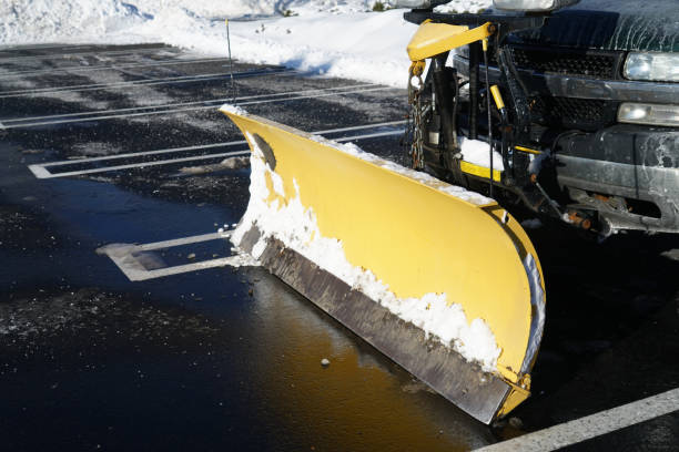 truck with snowplow installed in the parking lots - snowplow snow parking lot truck fotografías e imágenes de stock