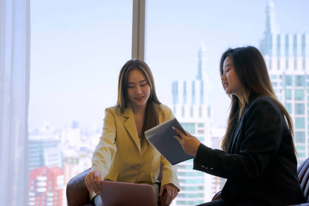 istock White collar workers are meeting at office tower. 1943998650