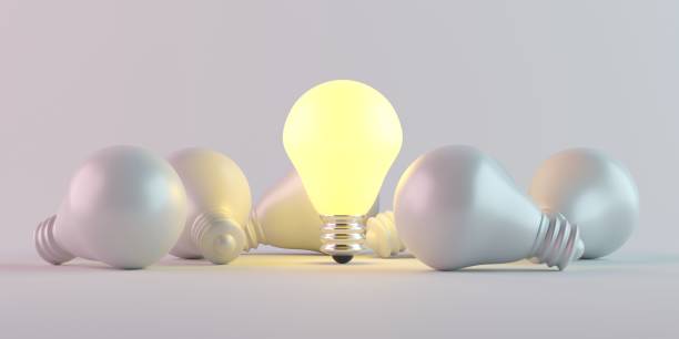 istock Illuminated light bulb standing Out in Crowd. Creative idea and inspire innovation 1944021951