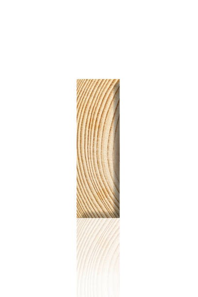 Close-up of three-dimensional tree ring alphabet letter I on white background.