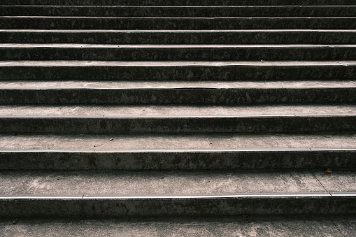 Close-up on a large outdoor concrete staircase.